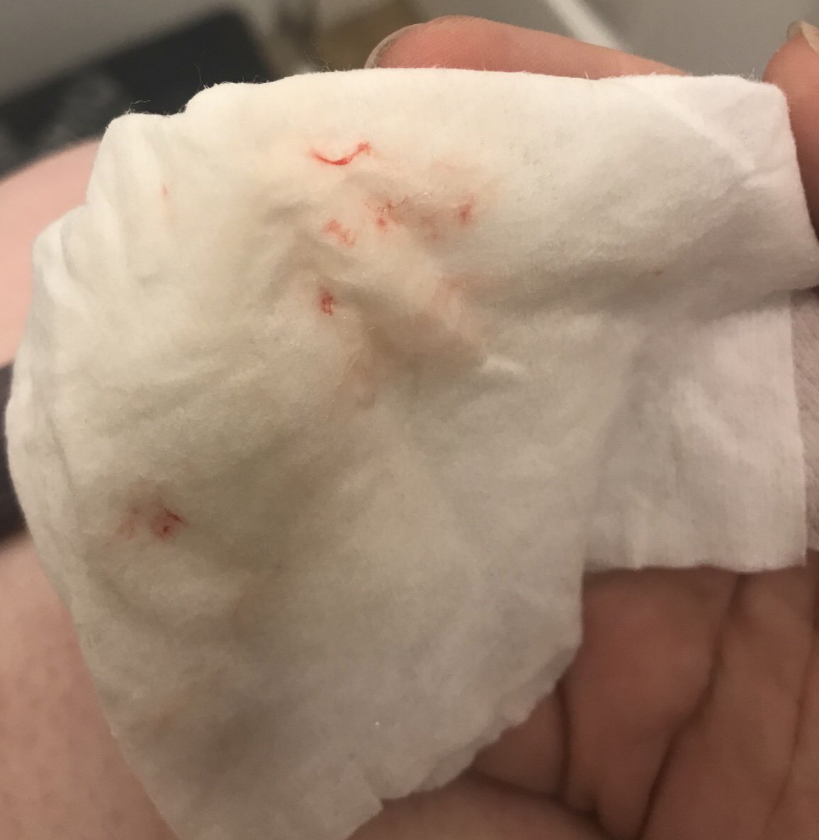Faint positive 2 days late, spotting with red stringy discharge